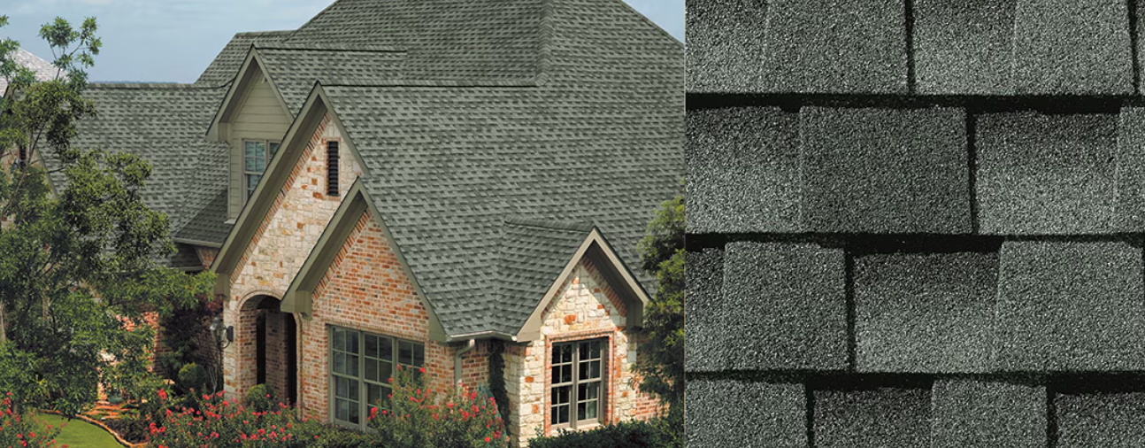 House with a dark gray shingled roof, brick exterior, and a close-up of the shingles.