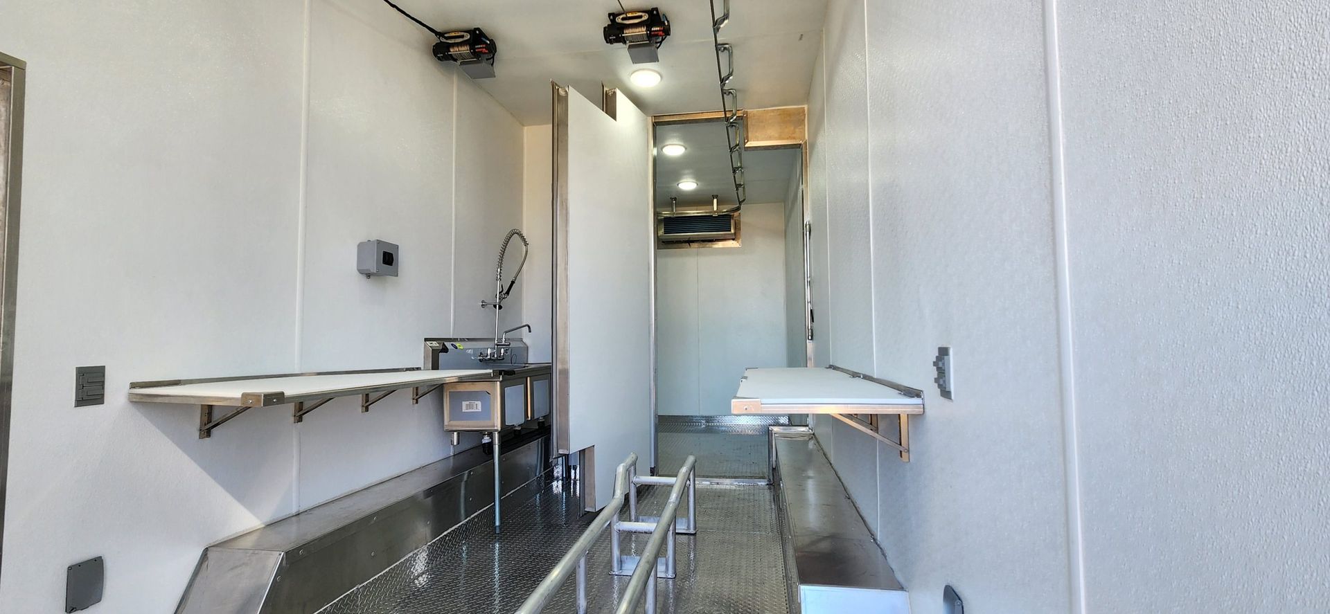 Inside a meat processing trailer made by Sentinel Trailers in Idaho Falls ID
