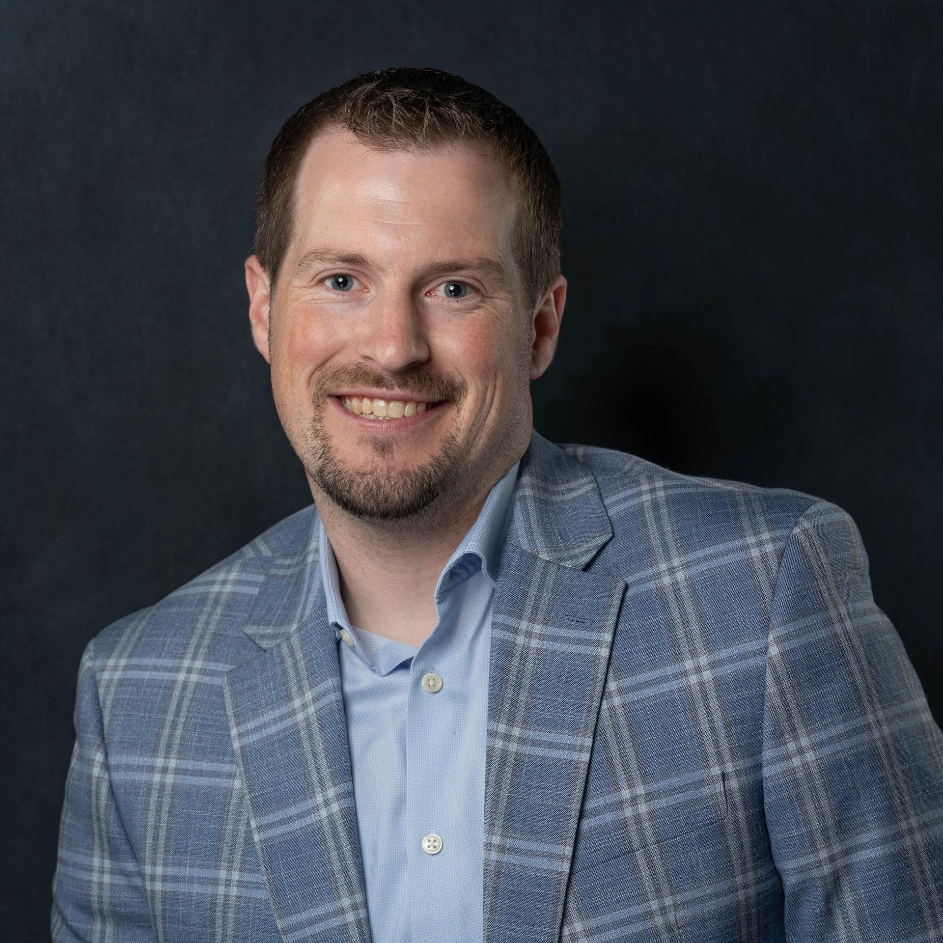 Pat Aukes Smiling in a suit