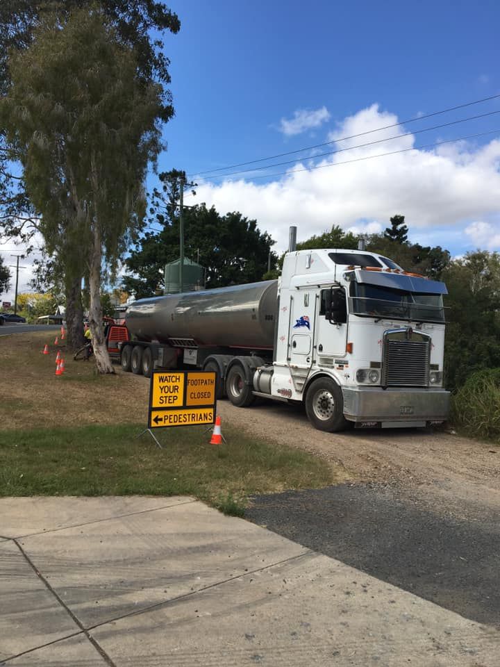 A Large Semi Truck Is Parked on The Side of The Road — Stolzenberg Water Carriers in Gympie, QLD