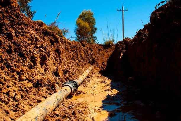 A Muddy Trench With A Pipe In The Middle Of It – Port Pirie, SA - Flinders Earthmoving & Blue Metal Supplies