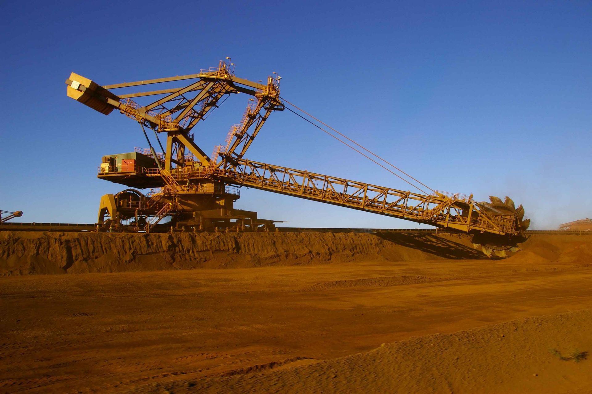 A Large Excavator Is In The Middle Of A Dirt Field – Port Pirie, SA - Flinders Earthmoving & Blue Metal Supplies
