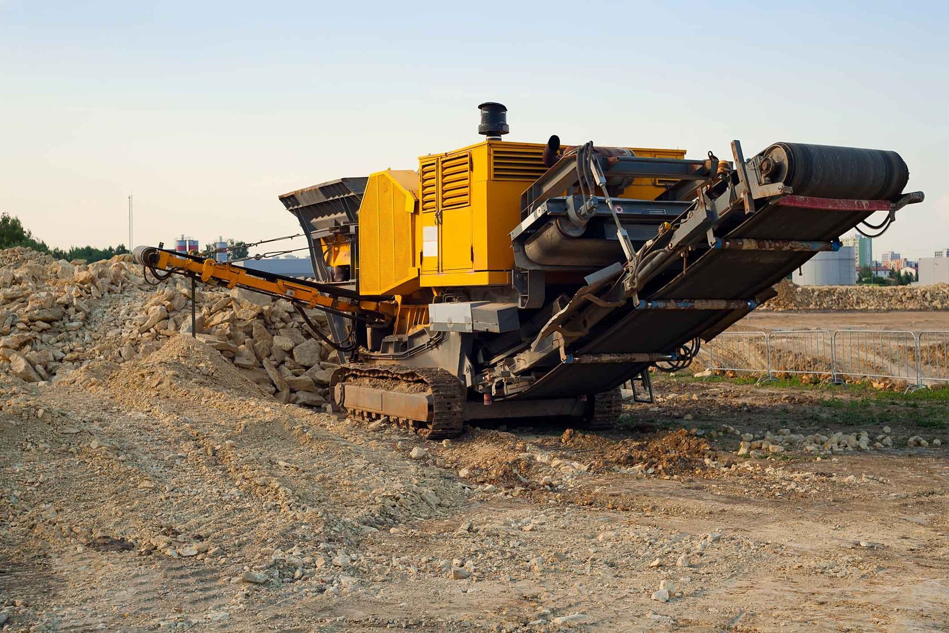 A Large Yellow Machine Is Sitting In The Middle Of A Dirt Field – Port Pirie, SA - Flinders Earthmoving & Blue Metal Supplies