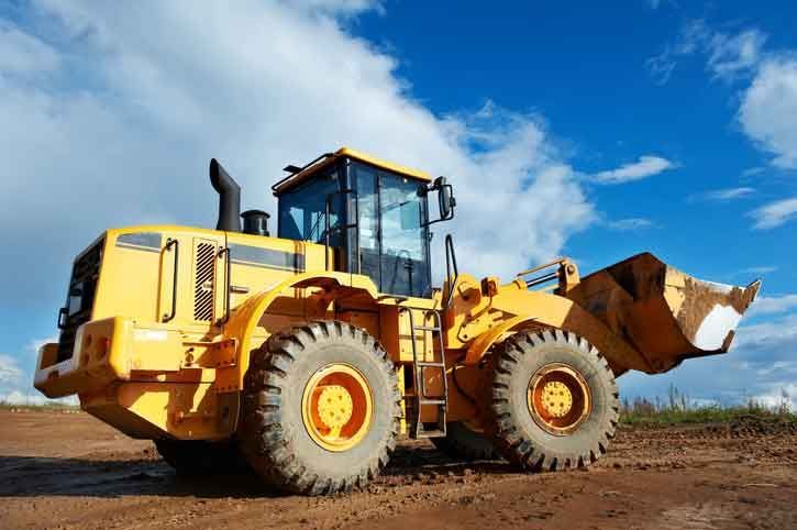 A Yellow Bulldozer Is Parked In A Dirt Field – Port Pirie, SA - Flinders Earthmoving & Blue Metal Supplies