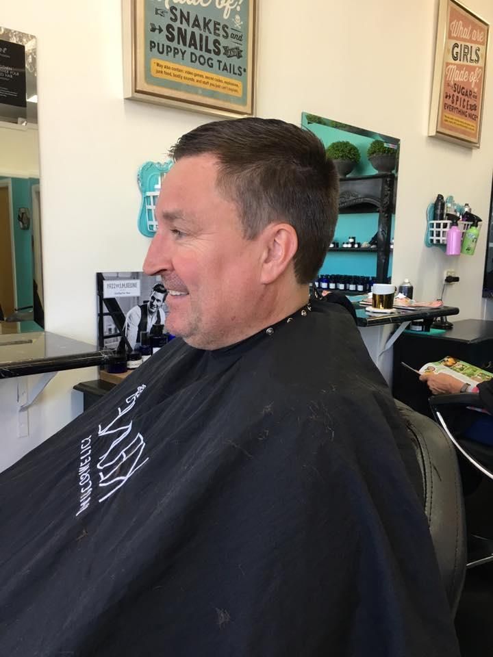 A Man is Getting His Hair Cut at a Barber Shop — Southside Hair & Beauty Design In South Tamworth, NSW
