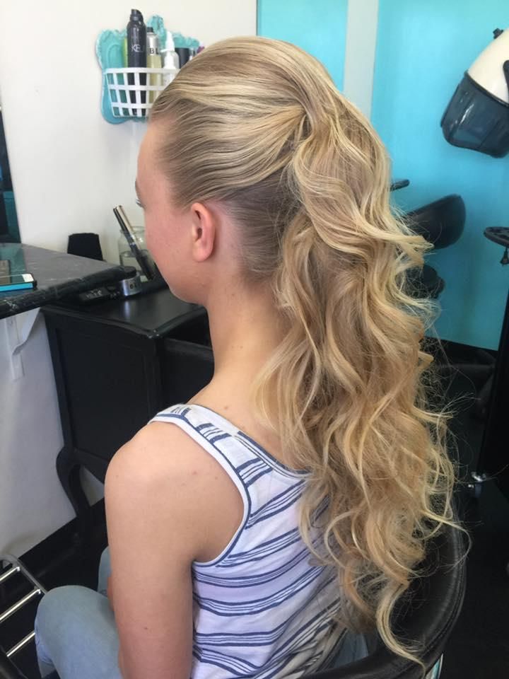 A Woman is Sitting in a Chair With Her Hair in a Ponytail — Southside Hair & Beauty Design In South Tamworth, NSW