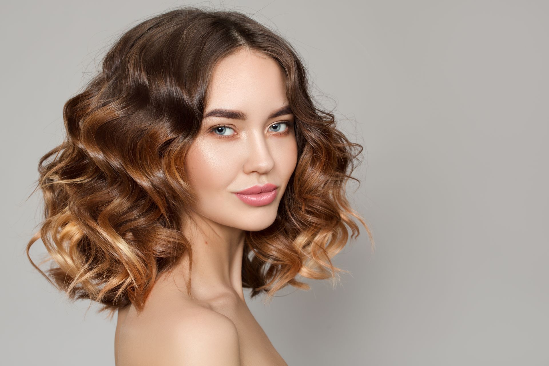 Woman With Shoulder-length Wavy Ombre Hair — Southside Hair & Beauty Design In South Tamworth, NSW
