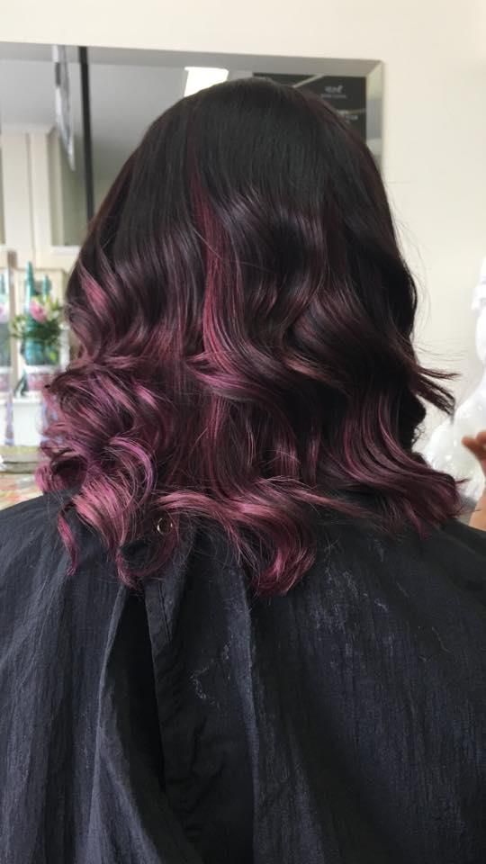 A Woman With Purple Hair is Sitting in a Chair in a Salon — Southside Hair & Beauty Design In South Tamworth, NSW
