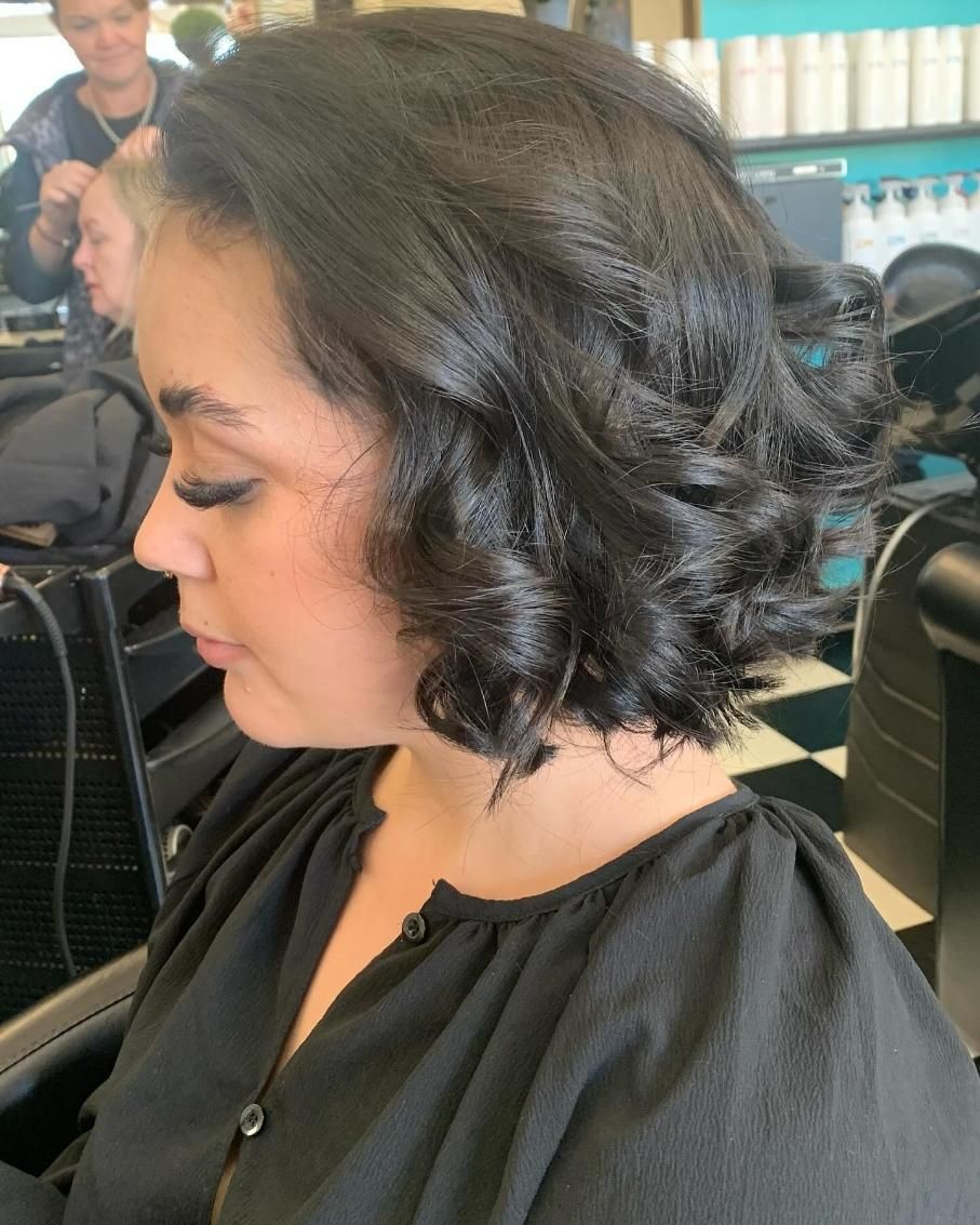 A Woman is Getting Her Hair Done in a Salon — Southside Hair & Beauty Design In South Tamworth, NSW