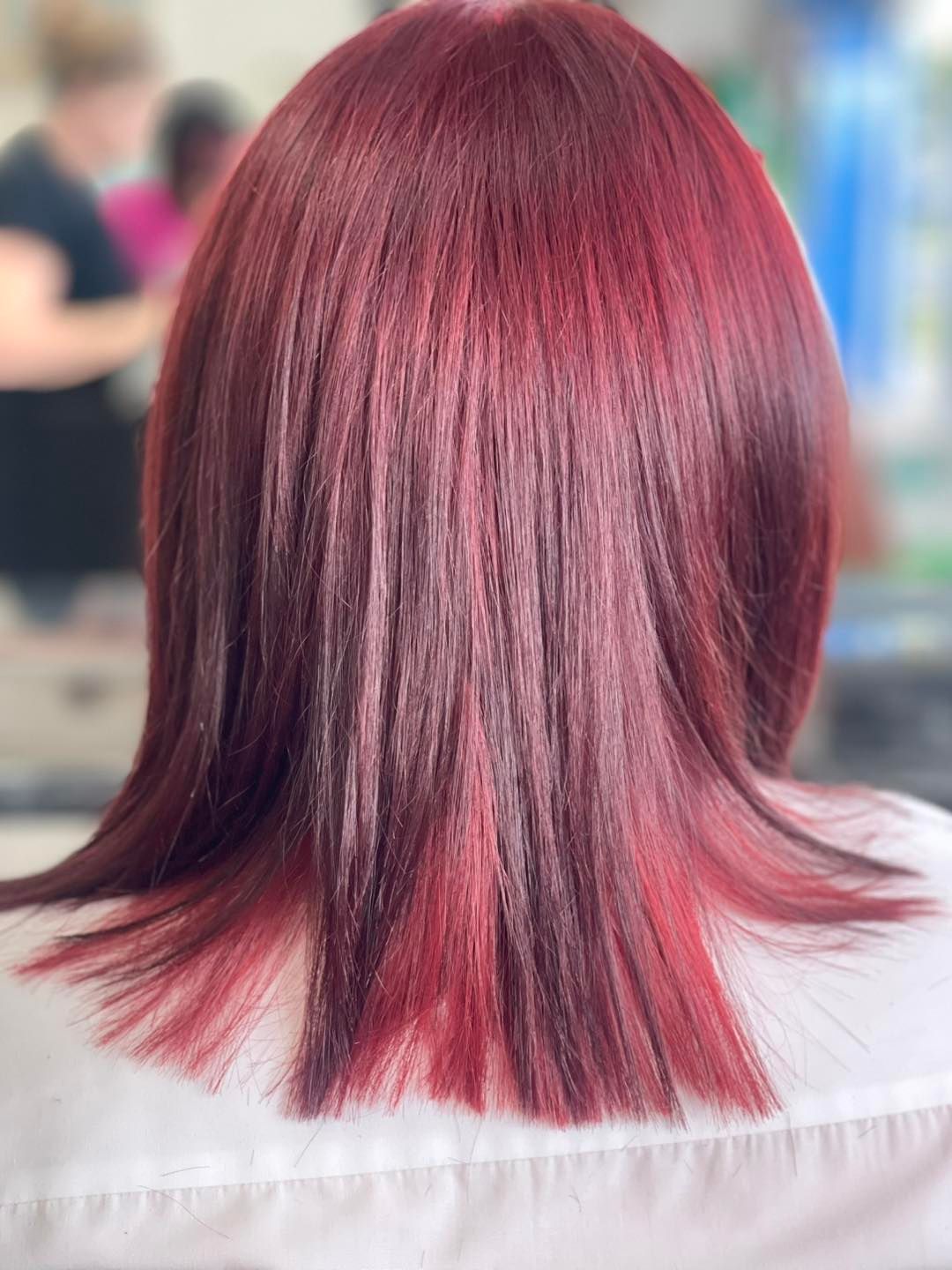 The Back of a Woman 's Head With Red Hair and a White Shirt — Southside Hair & Beauty Design In South Tamworth, NSW