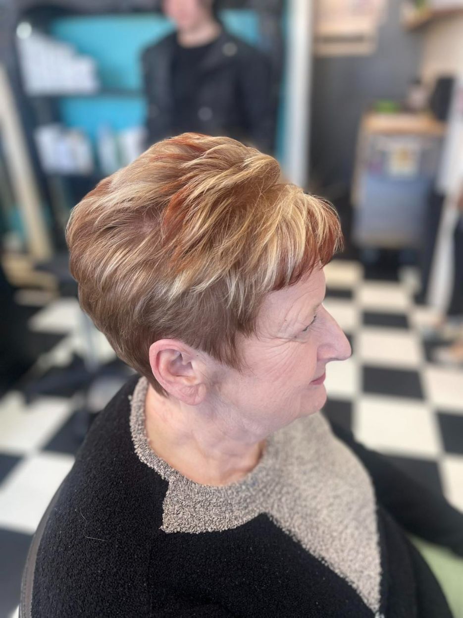 A Woman With Short Hair is Sitting in a Chair in a Salon — Southside Hair & Beauty Design In South Tamworth, NSW