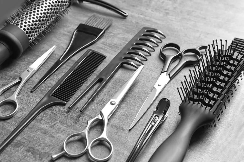 A Black and White Photo of a Hairdresser 's Tools on a Table — Southside Hair & Beauty Design In South Tamworth, NSW
