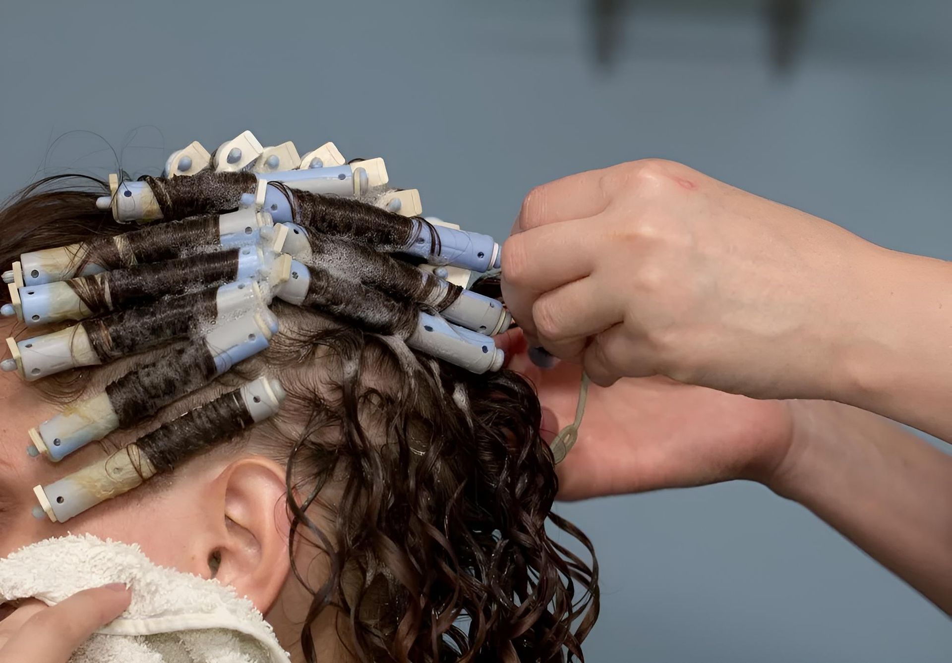 A Woman Getting Her Curled by Hairdresser— Southside Hair & Beauty Design In South Tamworth, NSW
