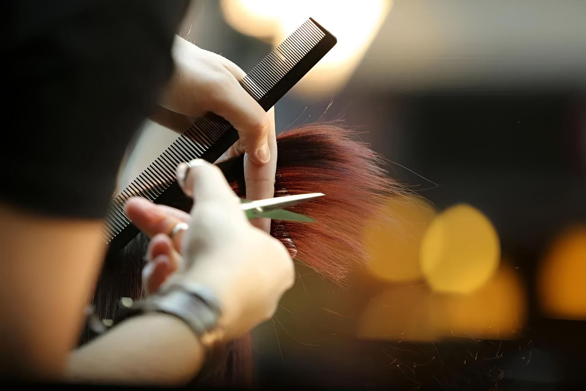 A Woman is Getting Her Hair Cut — Southside Hair & Beauty Design In South Tamworth, NSW