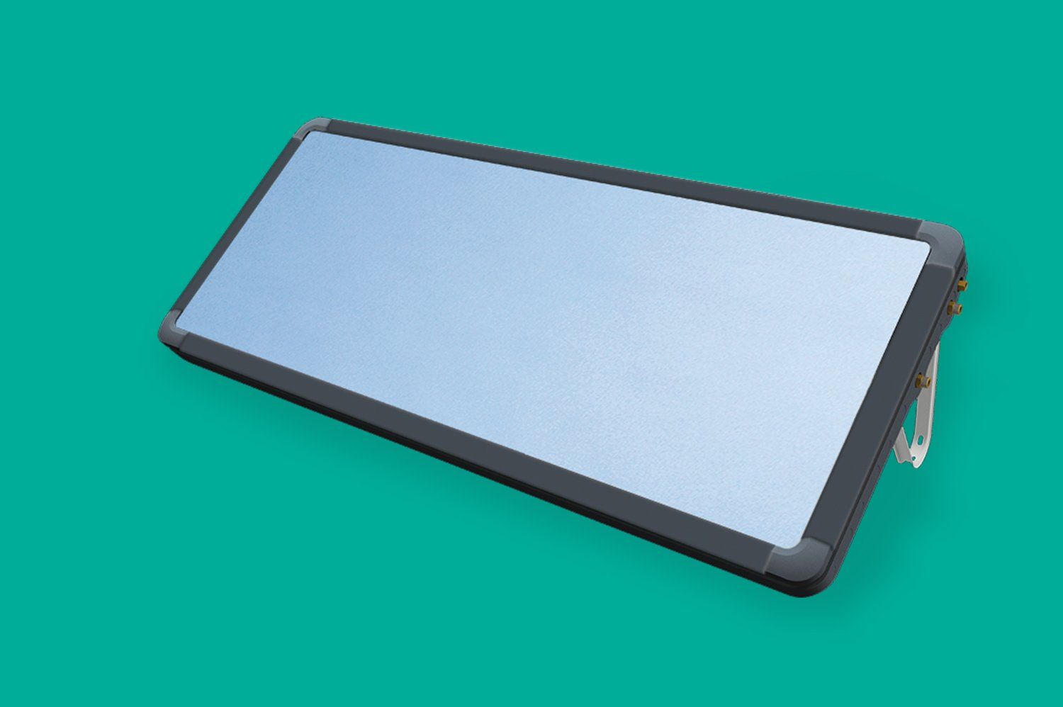 Un teléfono celular está sobre una superficie verde.