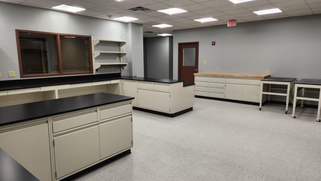An empty room with a lot of cabinets and shelves