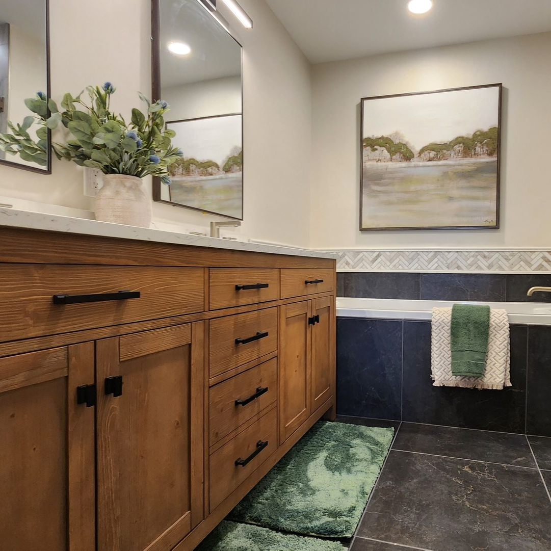 A bathroom with a walk in shower and a bathtub.