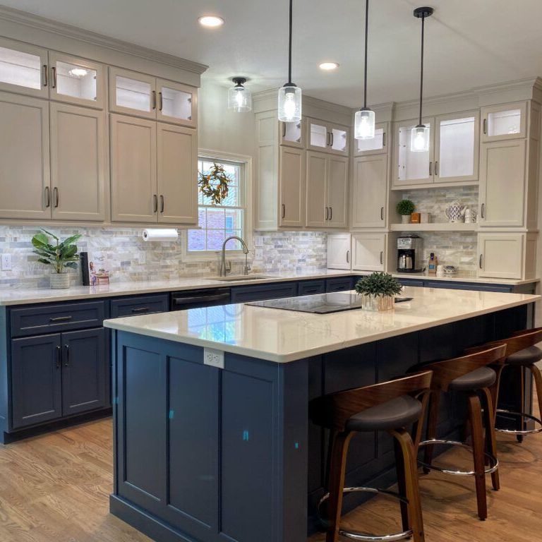 There is a large island in the middle of the kitchen.