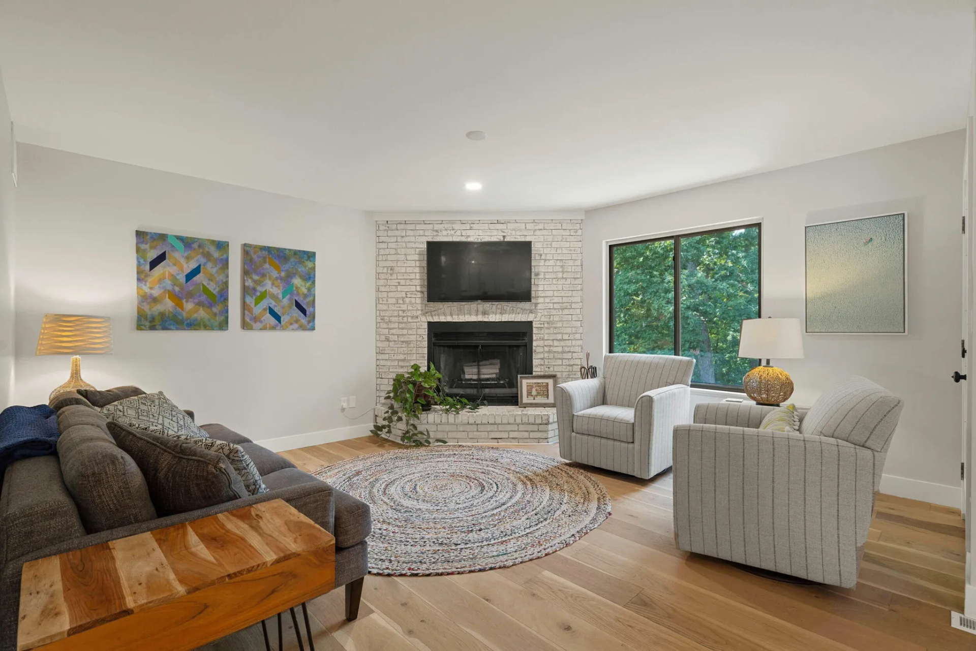 A living room filled with furniture and a fireplace.