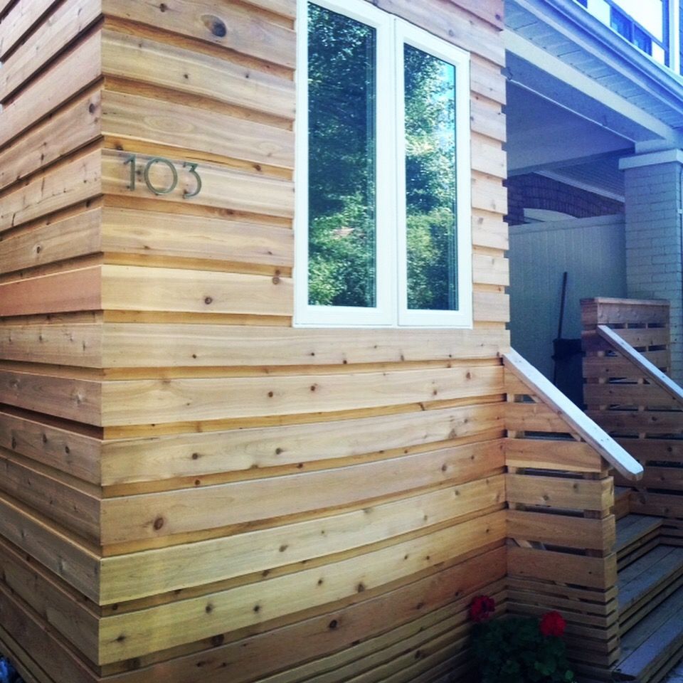 A wooden house with the number 103 on the side