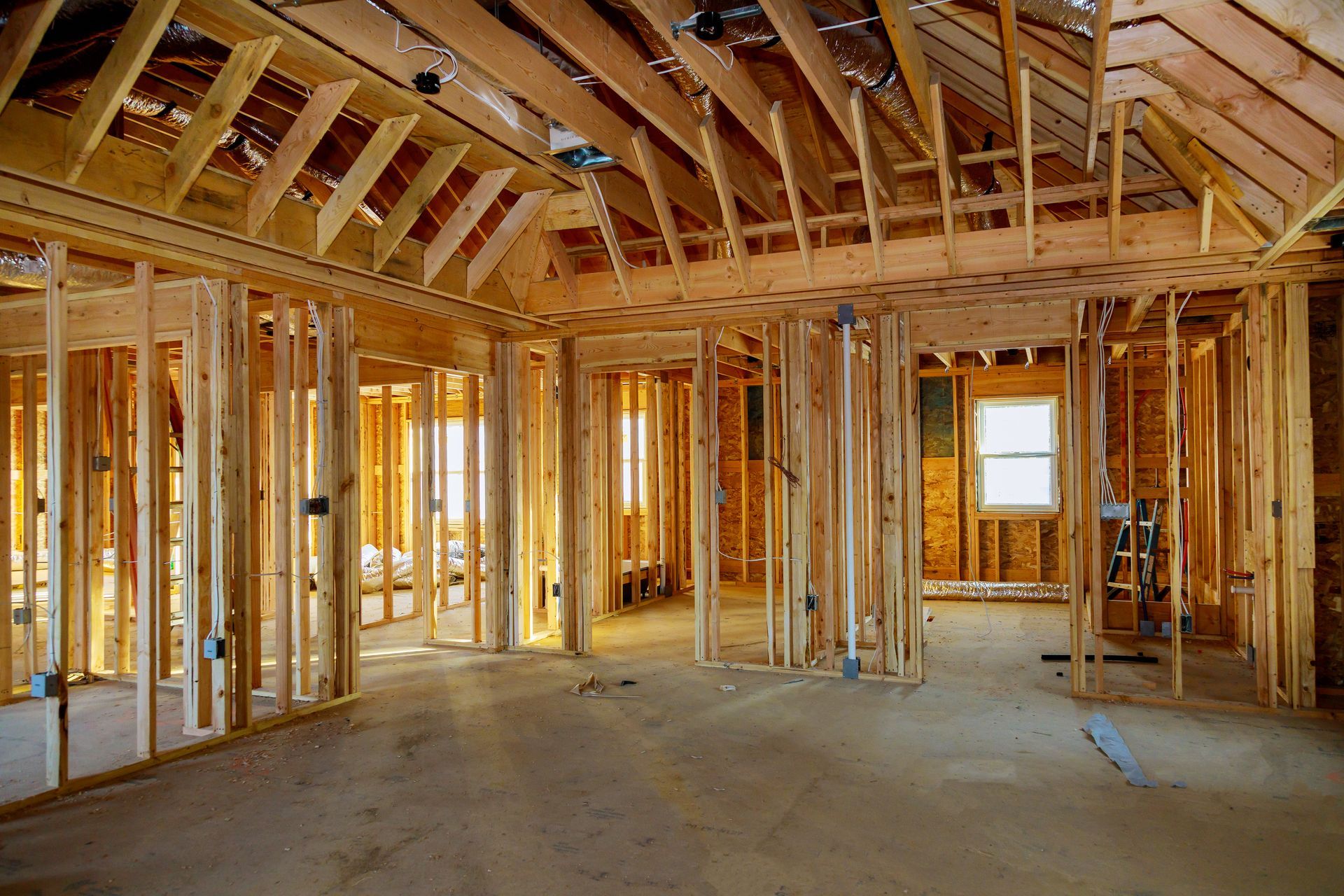 A house is being built with a lot of wooden beams.