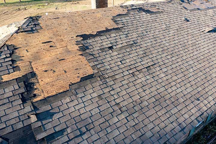 Tornado damage to roof and shingles.