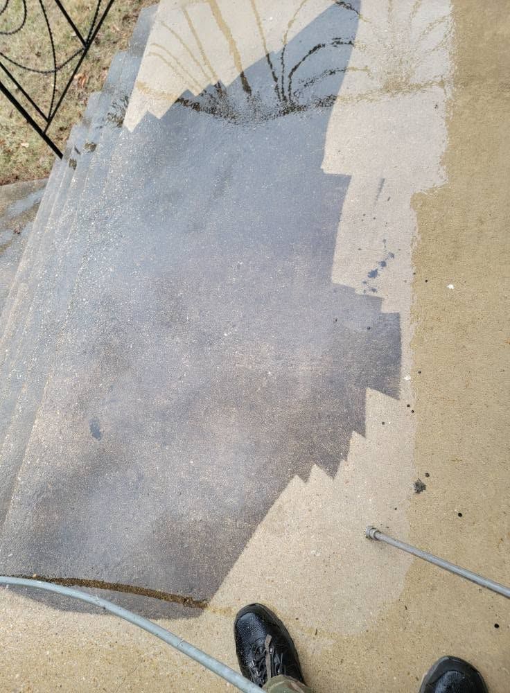 Wet carpet laid over a dusty concrete floor, with a shoe visible at the bottom edge.
