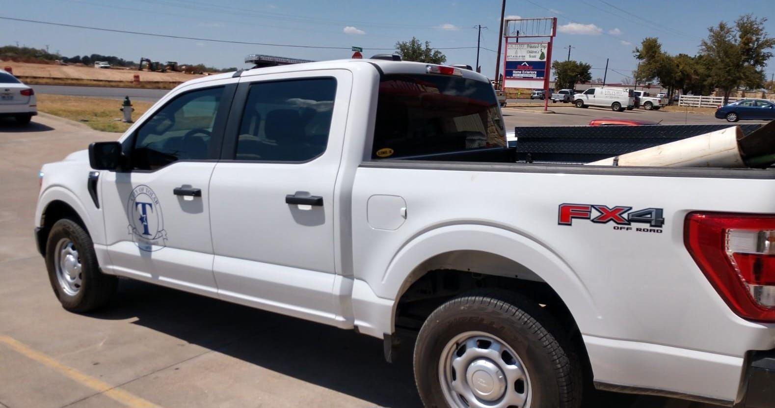 White Ford F-150 pickup truck with 