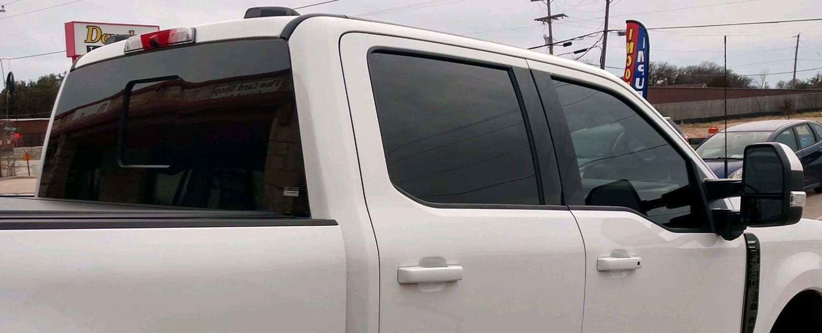 White pickup truck with tinted windows.