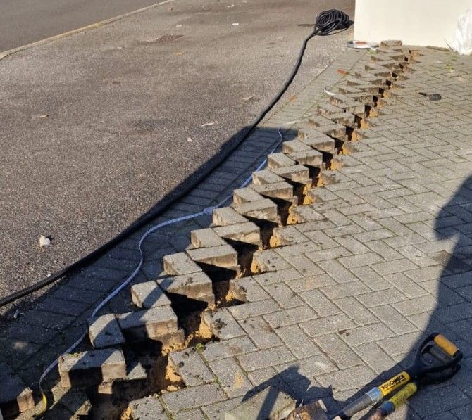 existing block paving lifted to allow the cabling to run discretely to the electric gate