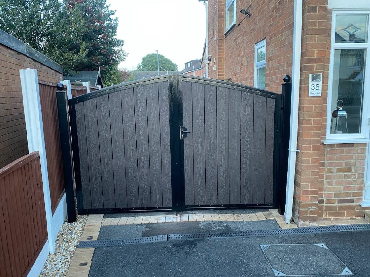 Composite Gates UK showing arched double composite driveway gates