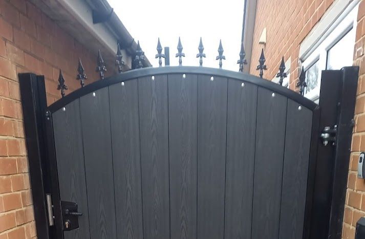 Composite Gates UK arched gate with fleur de lis gate top option