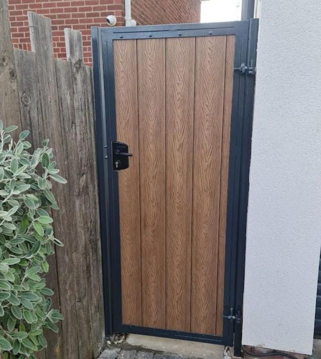 Oak effect composite gate with anthracite grey metal frame