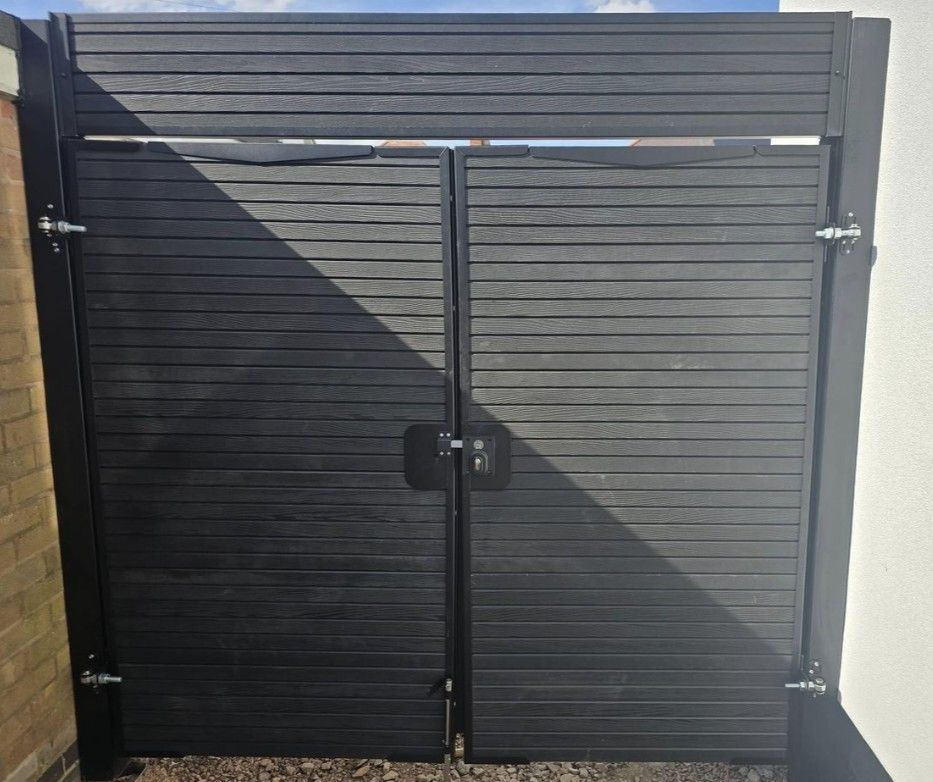 Composite Gates UK grey composite driveway gates with an additional panel top installed