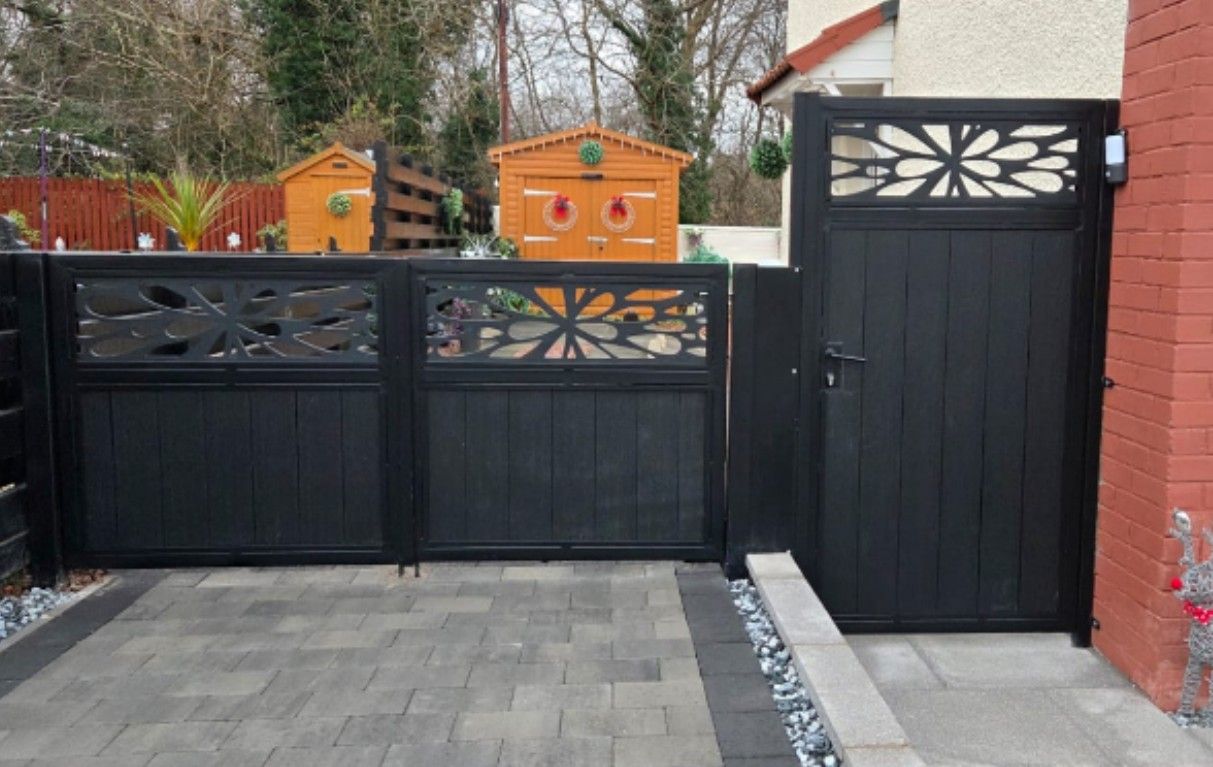 Anthracite grey composite driveway gates with decorative screen-panel tops, fitted in Fife