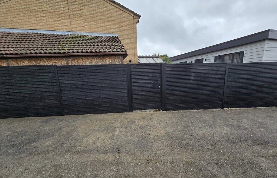 Composite Gates UK anthracite grey composite fencing with gate in Peterborough