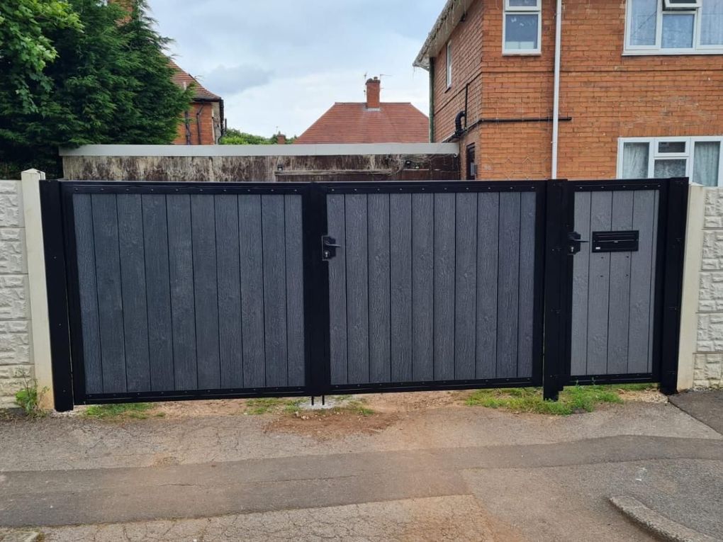Composite driveway gates with a matching pedestrian gate and letterbox