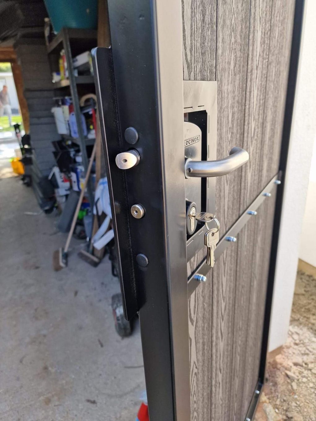 Composite gate part-built in the workshop, showing the steel frame with the lock and handle fitted