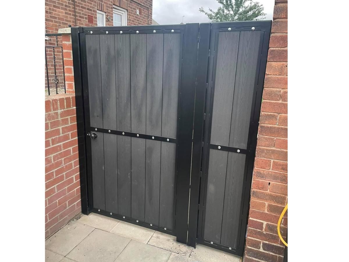 grey composite back gate with infill composite panel installed in Guildford