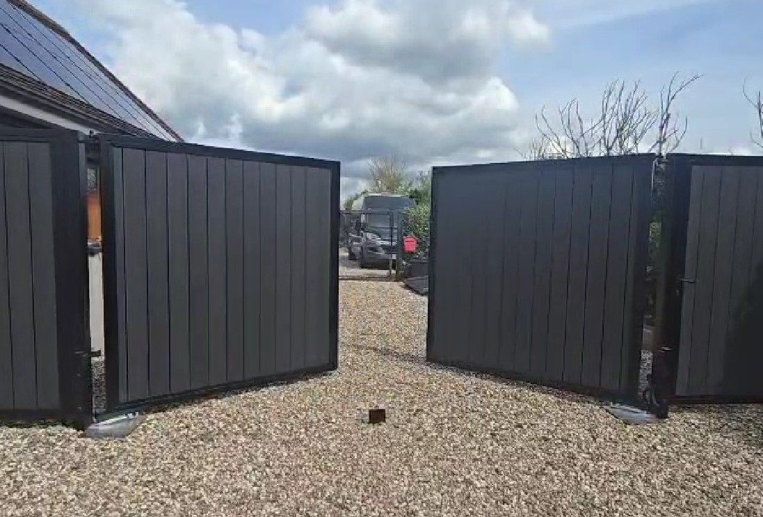Double electric composite swing gates installed in South London