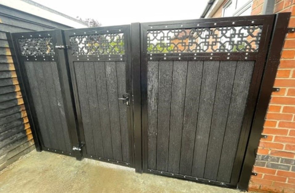 grey composite back gate with infill composite panel installed in Keighley