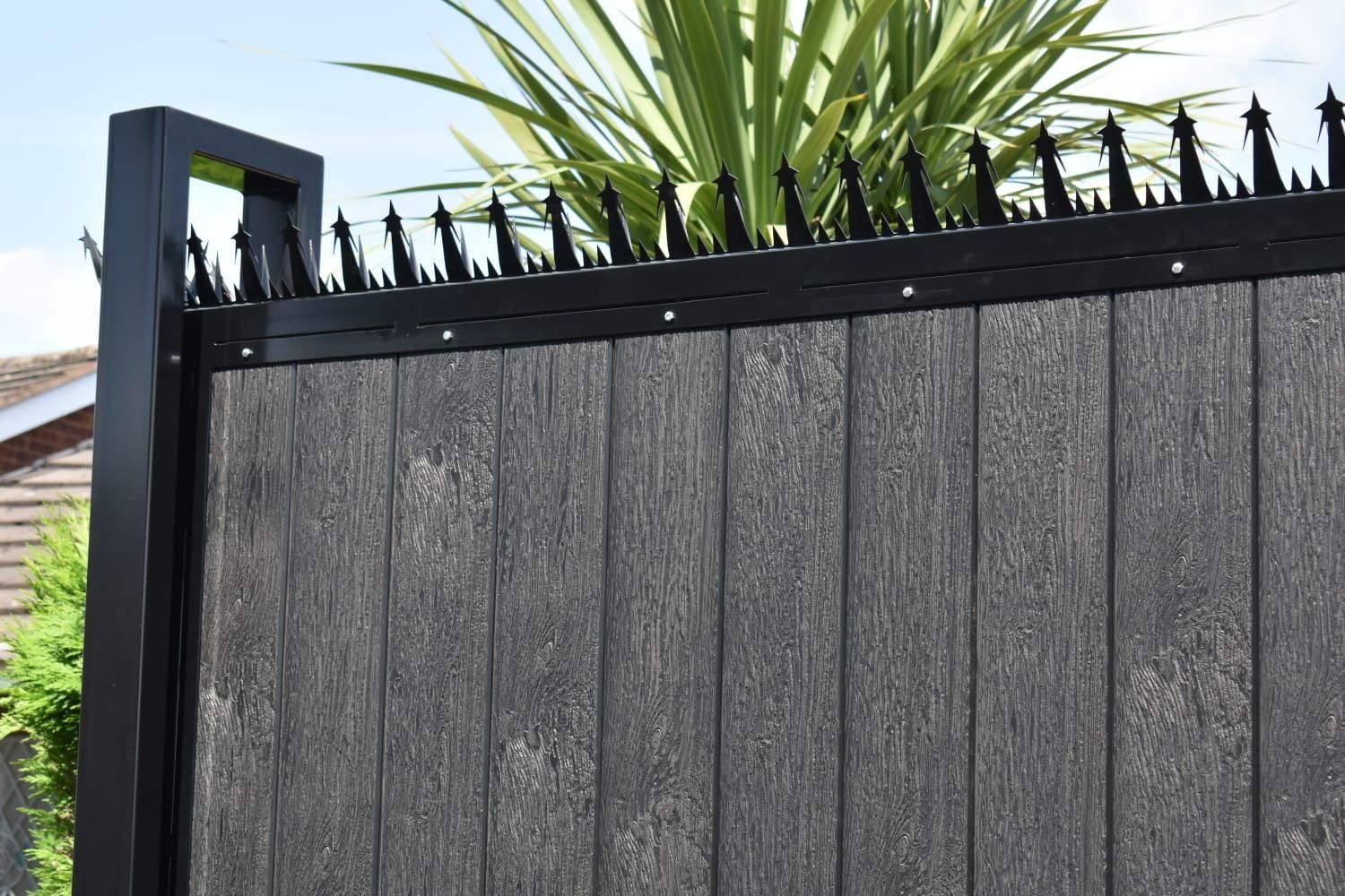 close up of manual composite gates with security topping
