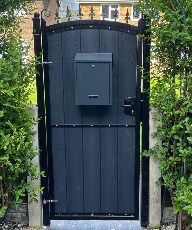 Arched composite pedestrian gate with fleur de lis finials and letterbox installed in Milton Keynes