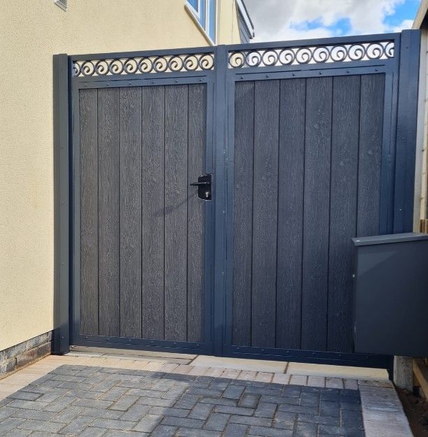 grey composite driveway gates with matching frame