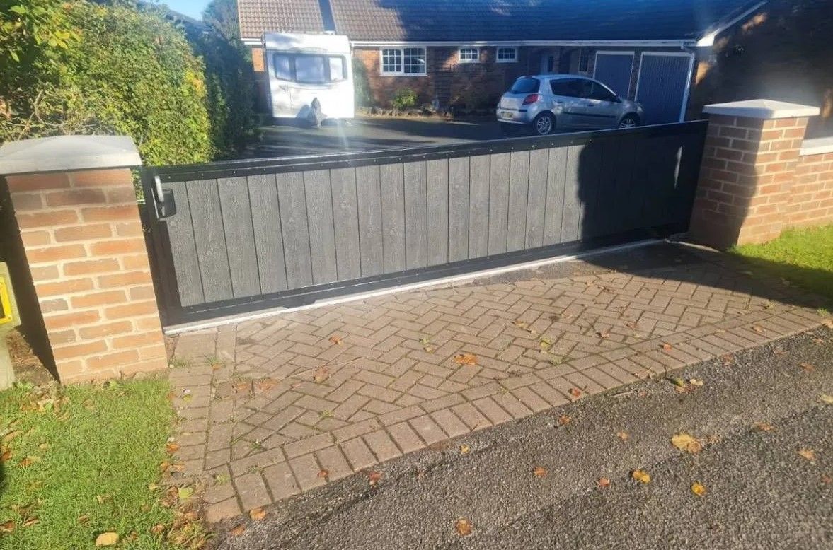 3 foot high sliding composite driveway gate fitted in South London