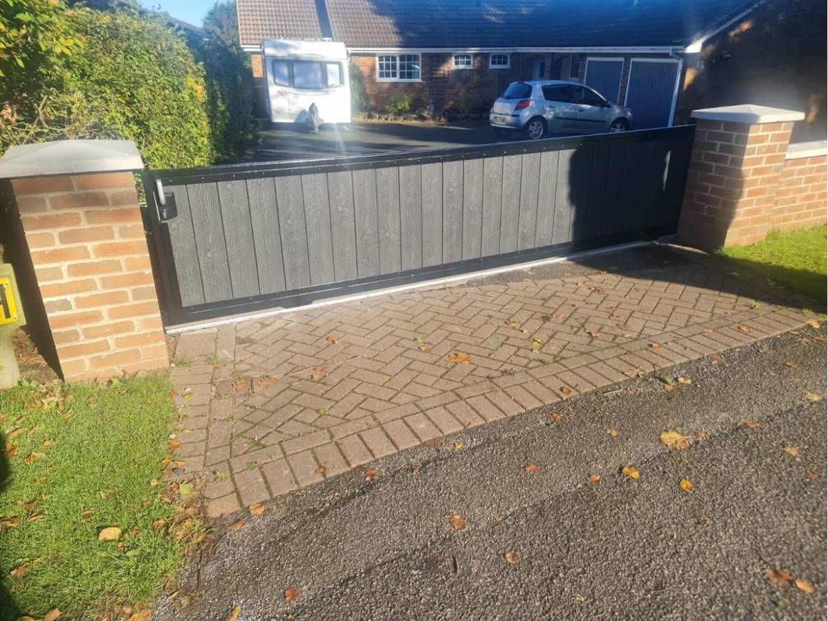 3 foot high sliding composite driveway gate fitted in Guildford