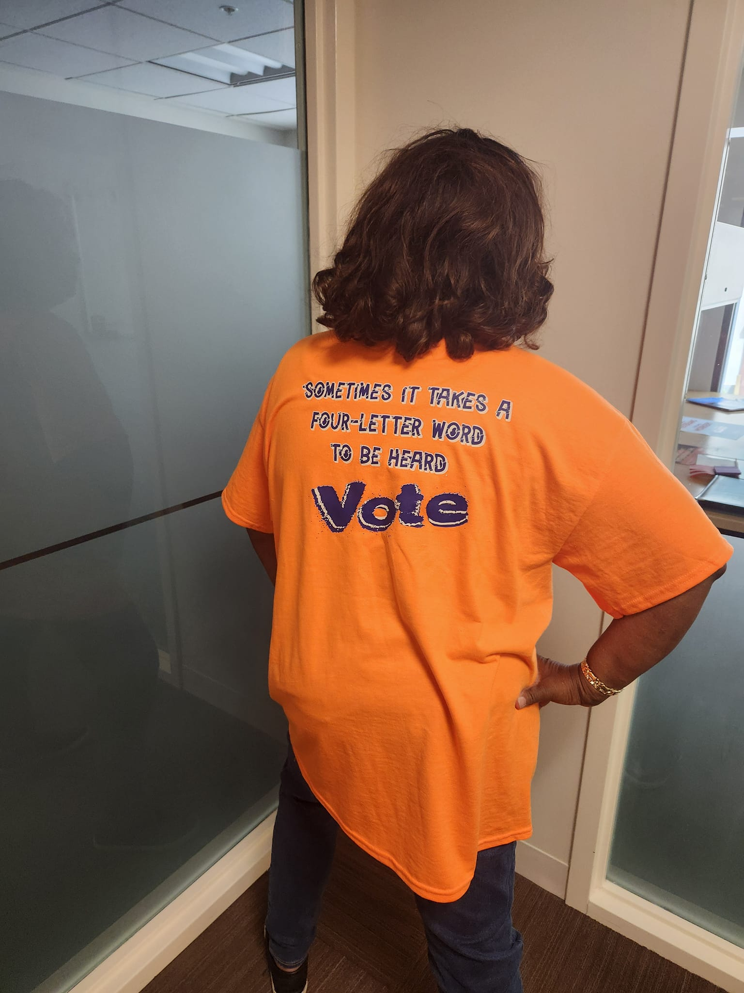 orange shirt back says bote is a four letter word