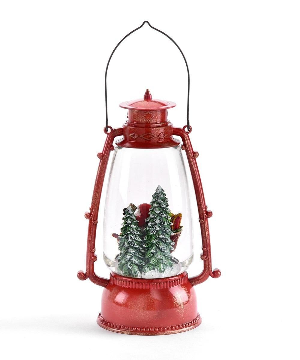 A red lantern with trees inside of it on a white background.