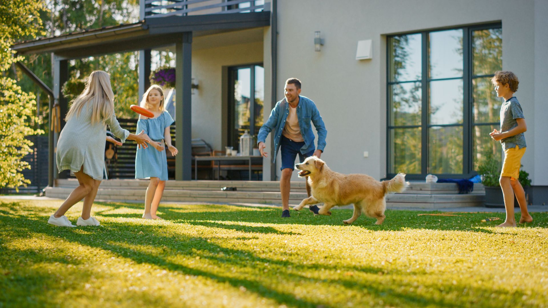 Family Playing With Dog