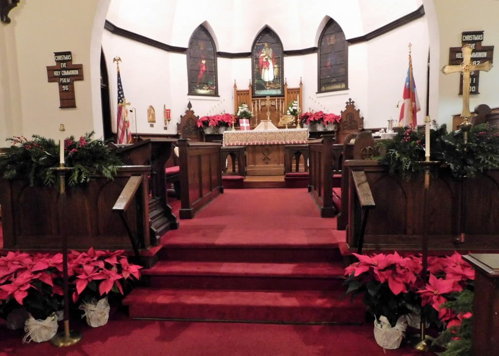 Christmas poinsettias and church interior